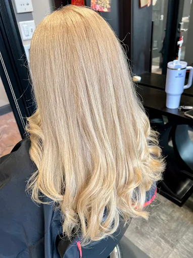Golden blonde balayage with soft, loose waves